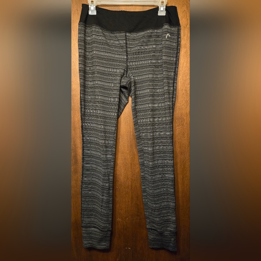 Head brand black and white stripped leggings, size L.